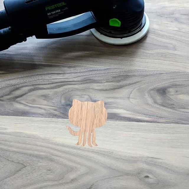 The Github Octocat logo is embedded in a walnut table